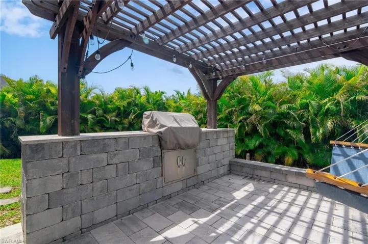 View of patio / terrace with exterior kitchen and a pergola