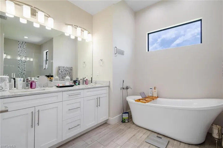 Bathroom featuring dual bowl vanity