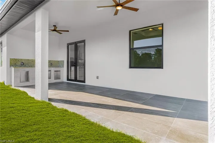 View of patio featuring a ceiling fan