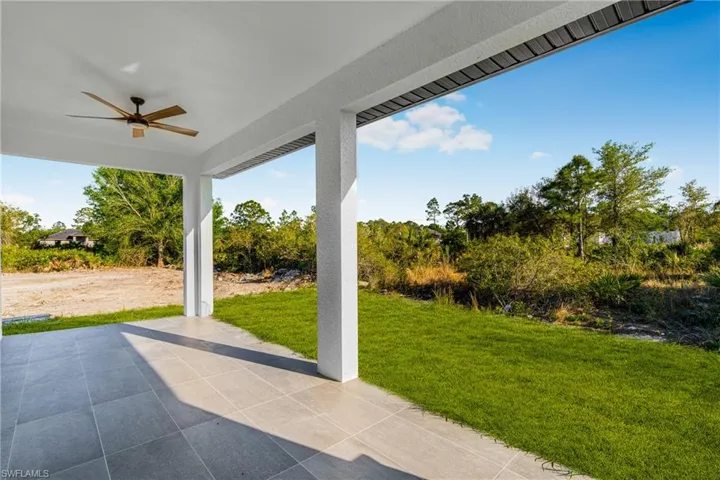 View of patio featuring ceiling fan