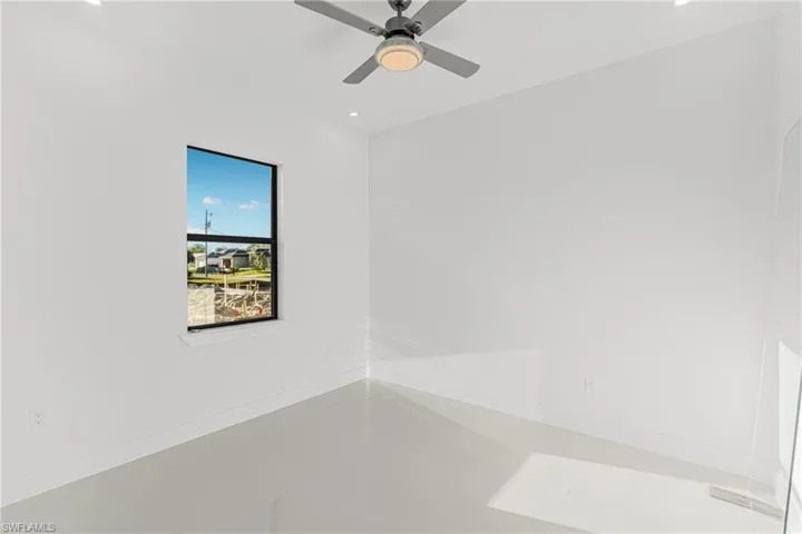 Empty room with recessed lighting and ceiling fan