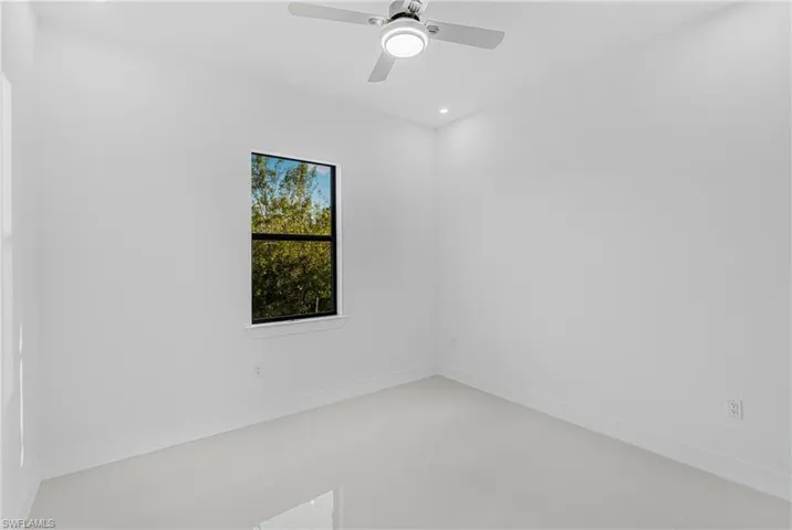 Spare room with recessed lighting, baseboards, and ceiling fan