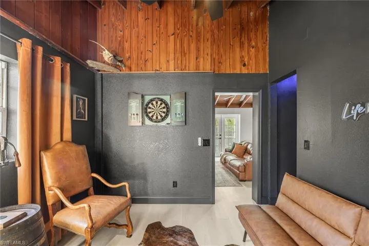 Living area with a textured wall and french doors
