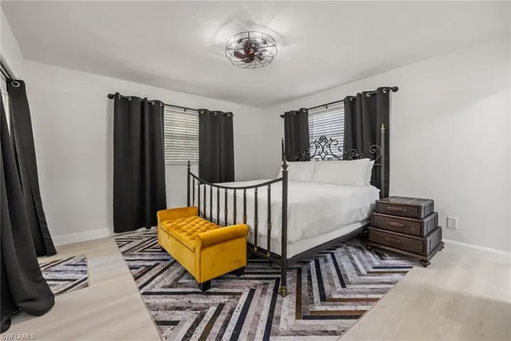 Bedroom featuring baseboards and light wood finished floors