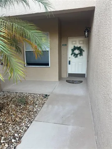 Property entrance with stucco siding