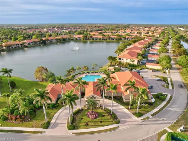 Aerial perspective of suburban area with a large body of water