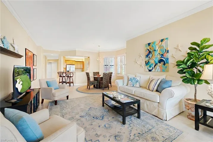 Living room featuring crown molding