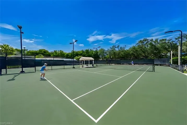 View of tennis court featuring a gazebo