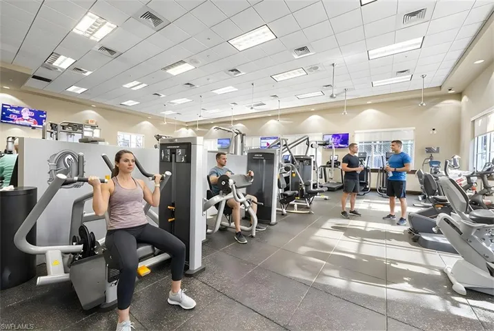 Workout area featuring a drop ceiling