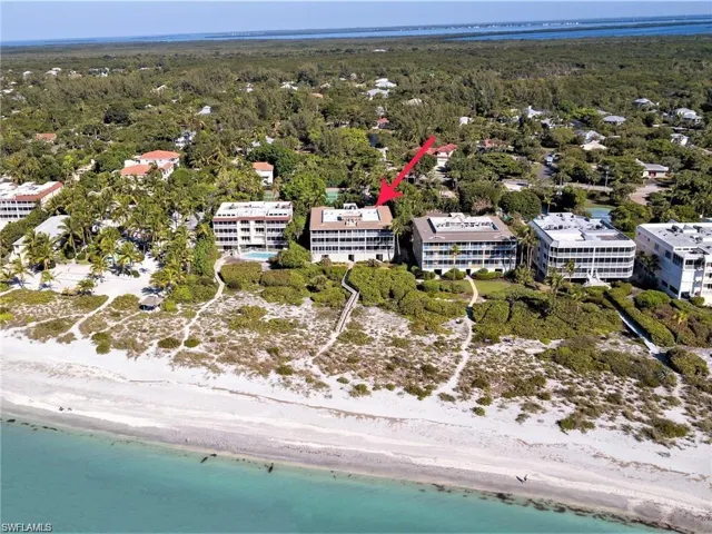 pre-Ian Drone / aerial view with a beach view, a forest view, and a water view