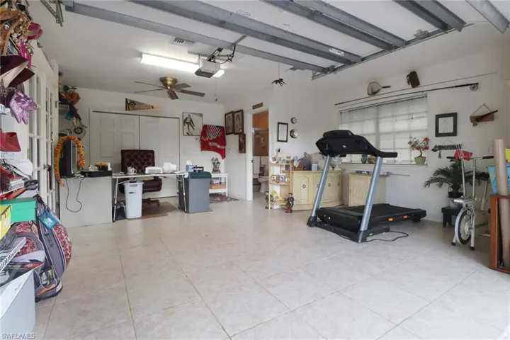 Garage featuring a desk and a garage door opener