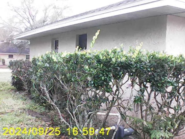 View of side of home featuring stucco siding