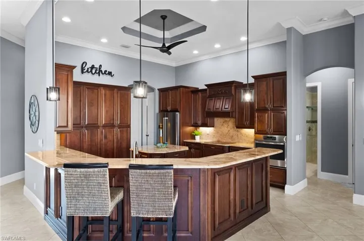 Large kitchen with granite counter and stainless steel appliances