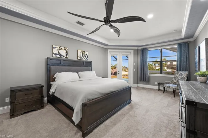Primary Bedroom with patio door to the pool