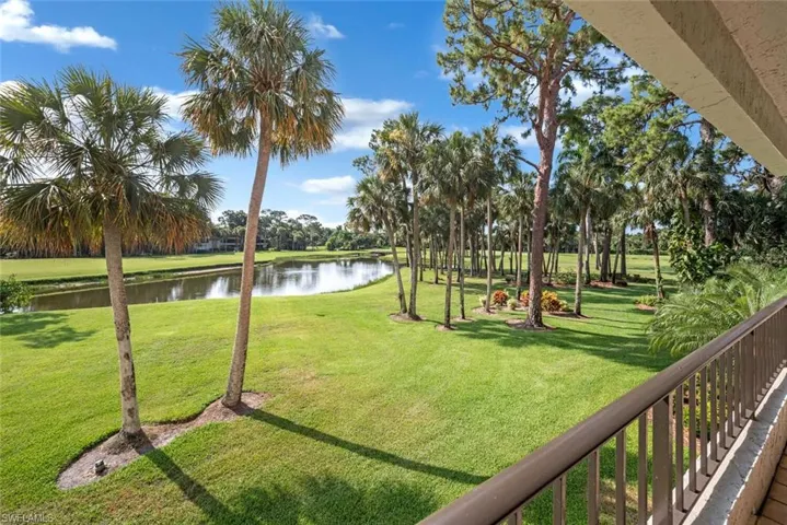Balcony  View of yard featuring a water view
