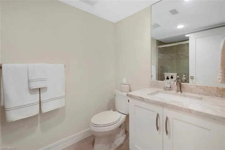 Bathroom with oversized vanity and toilet