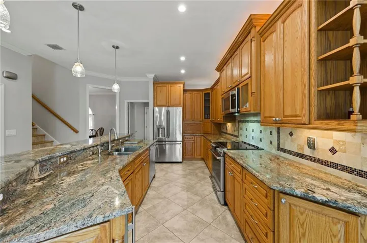 Beautiful granite and real wood cabinetry