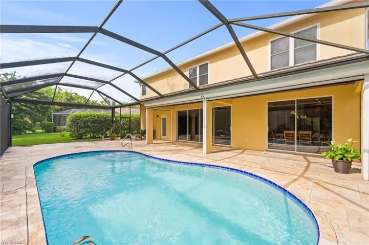 Sparkling pool and huge lanai with covered space and sun deck.