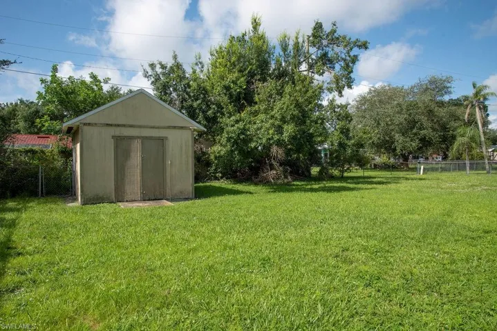 Ranch-style home with a garage, stucco siding, and driveway