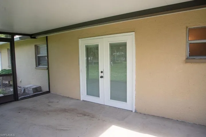 Ranch-style home with driveway, stucco siding, an attached garage, and a shingled roof