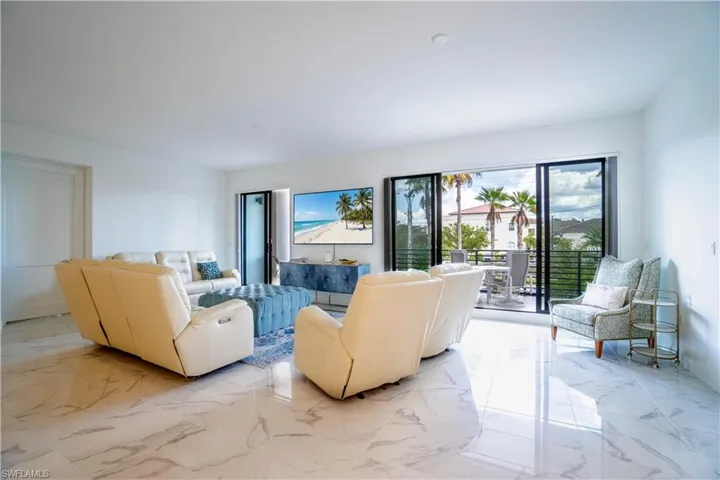 Living area featuring light marble finish flooring