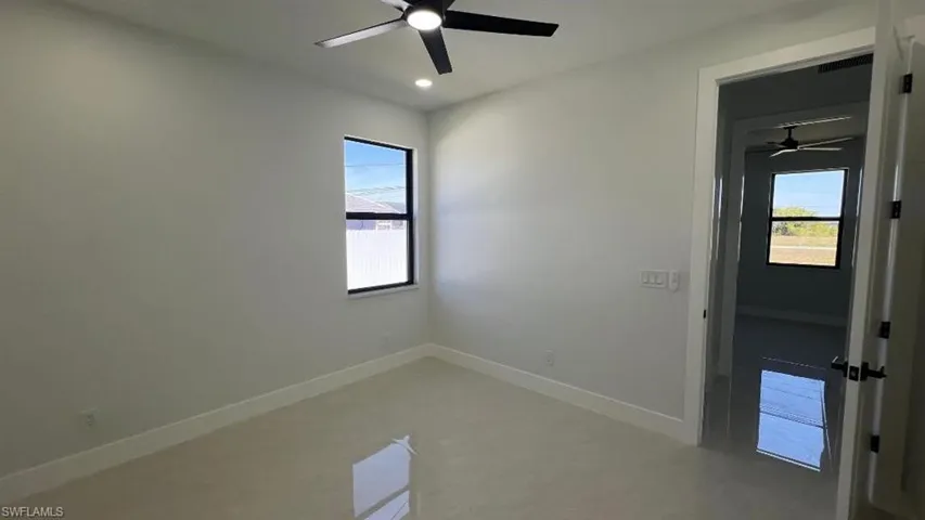 Unfurnished room featuring baseboards, ceiling fan, and recessed lighting