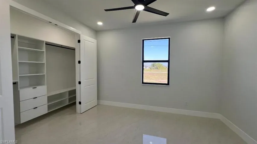 Unfurnished bedroom with baseboards, ceiling fan, and recessed lighting