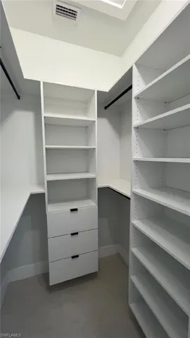 Walk in closet with visible vents