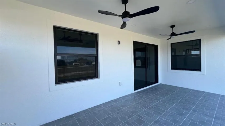 View of patio featuring a ceiling fan