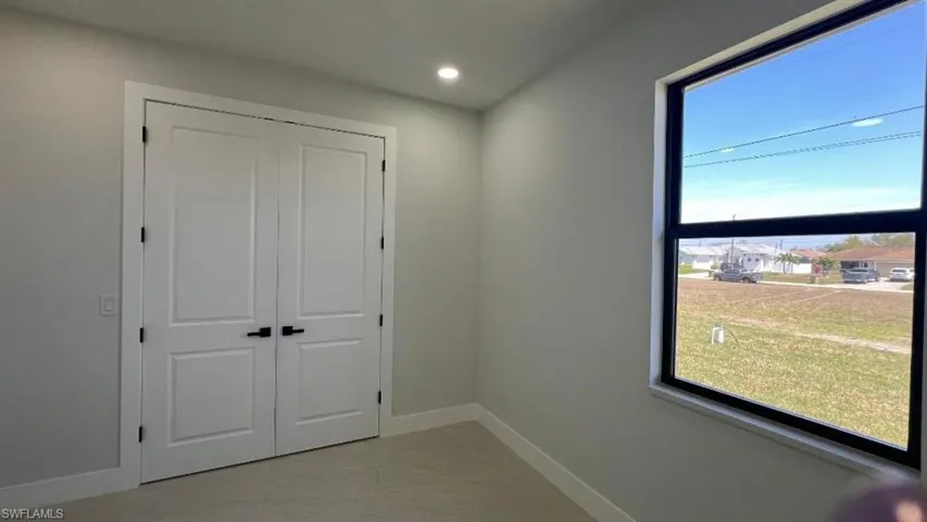 Hall featuring baseboards and recessed lighting