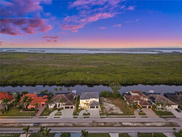 Aerial view at dusk of a residential view and a water view