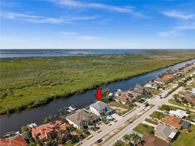 Aerial view of residential area with a large body of water