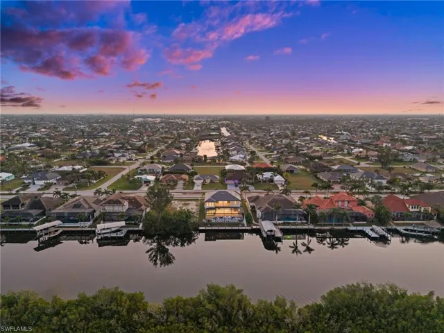 Aerial overview of property's location featuring nearby suburban area and a nearby body of water