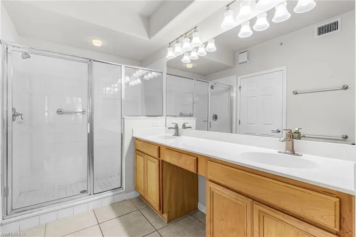 Dual sink Vanity and large shower with walk in closet