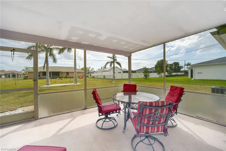 Sunroom / solarium with a residential view