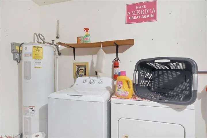 Water heater, laundry area, and washer and dryer