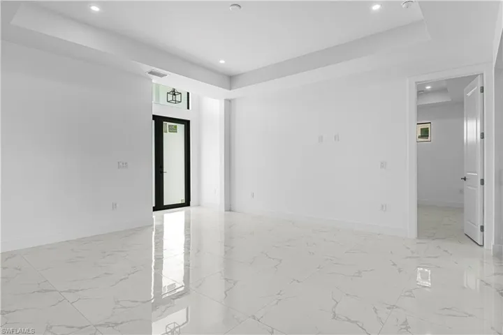 Spare room with a tray ceiling