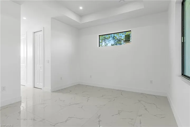 Empty room with a raised ceiling