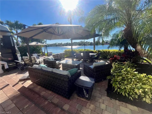 View of patio / terrace featuring an outdoor hangout area, a water view, and outdoor dining area