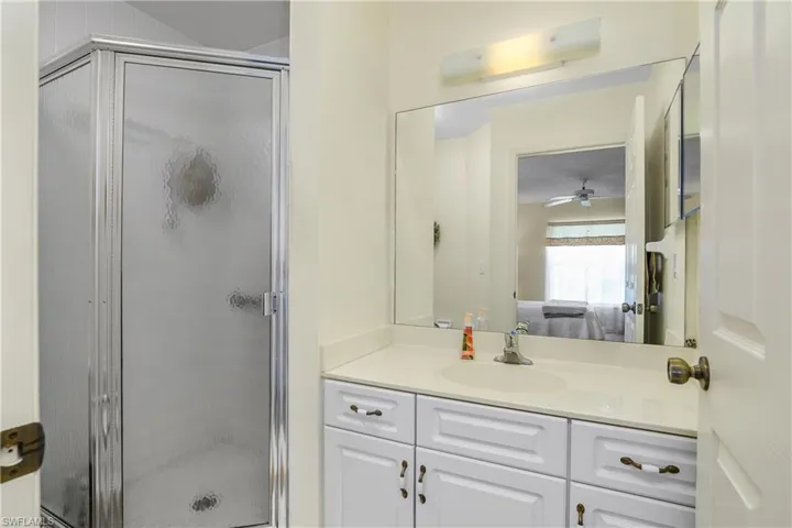 Ensuite bathroom with vanity and a stall shower