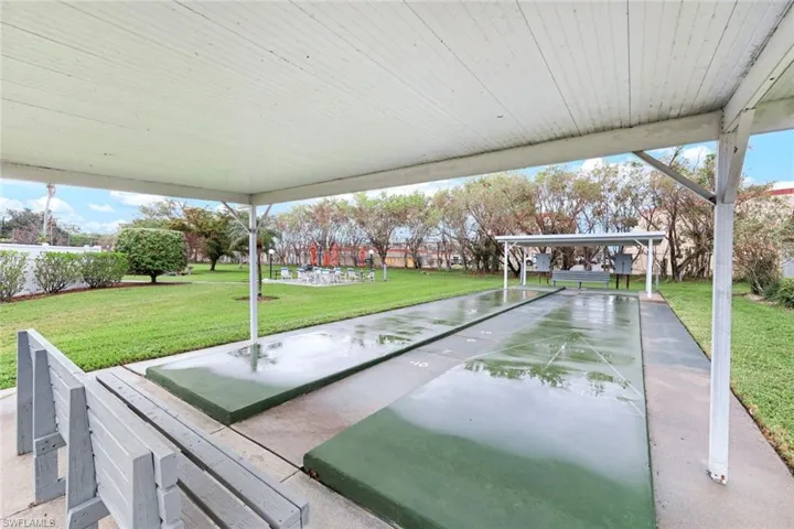 View of property's community featuring a lawn