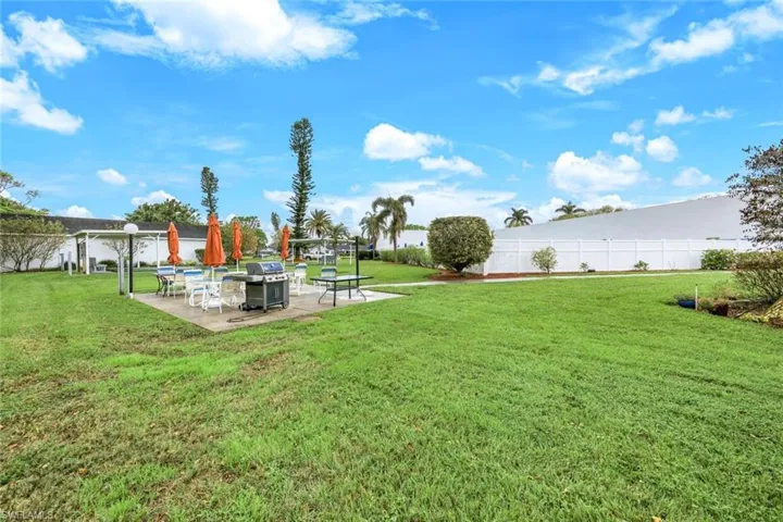 View of yard with a patio area and an outdoor fire pit