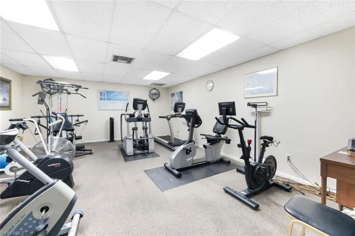 Workout area featuring a paneled ceiling