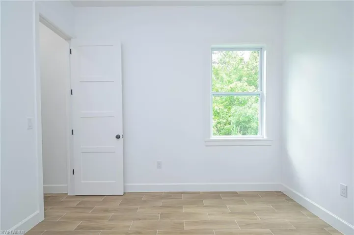 Unfurnished room featuring a wealth of natural light
