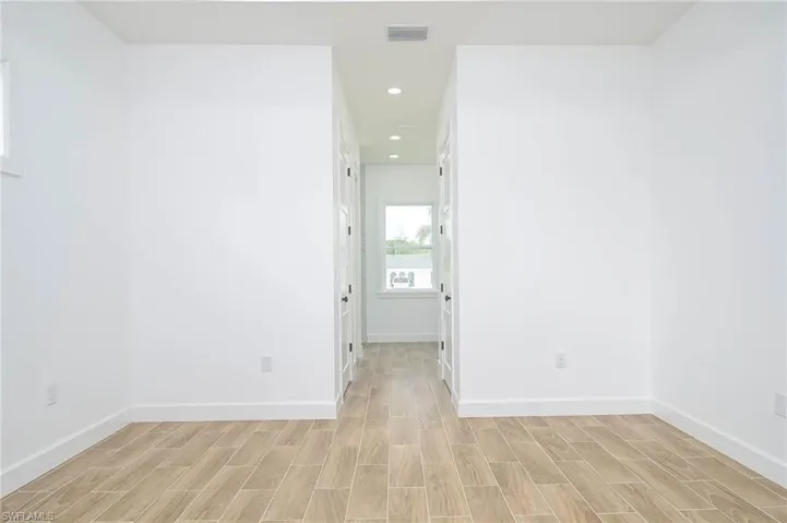 Unfurnished room with light wood-type flooring