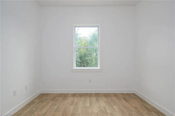 Empty room featuring light hardwood / wood-style flooring