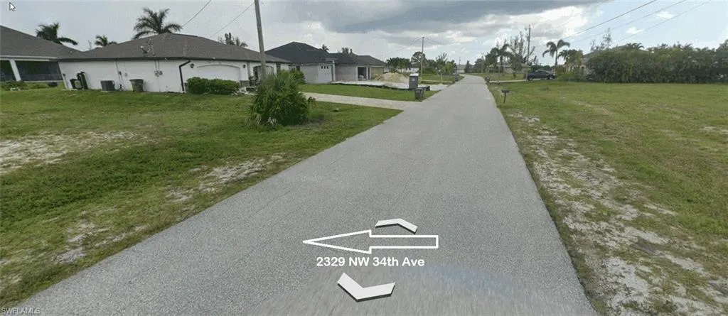 View of asphalt street with a residential view