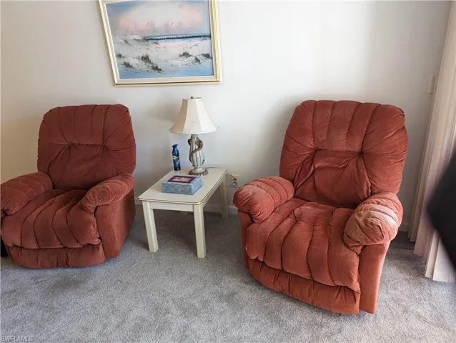 Sitting room with carpet flooring