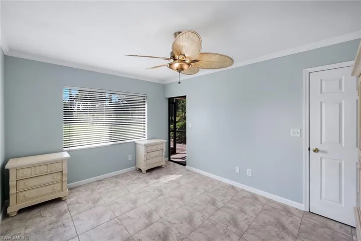 Light blue walls with white crown molding and baseboards