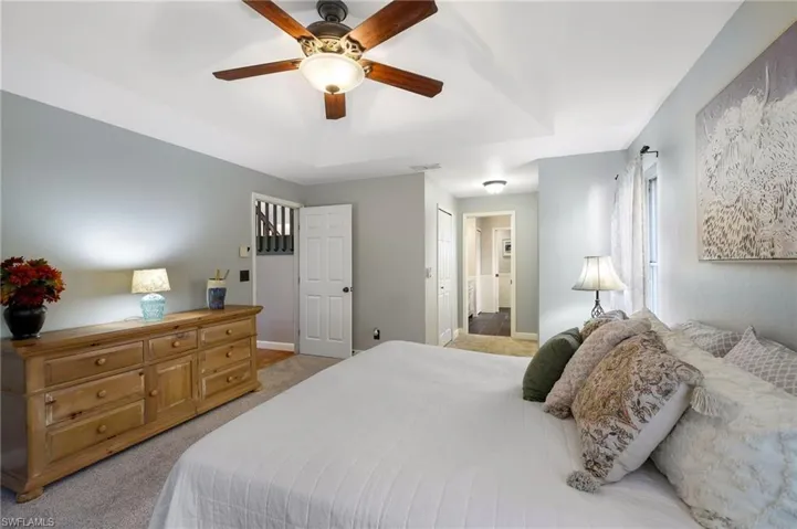 Ground floor main bedroom suite includes walk-in closet, additional closet, pocketing door to bath